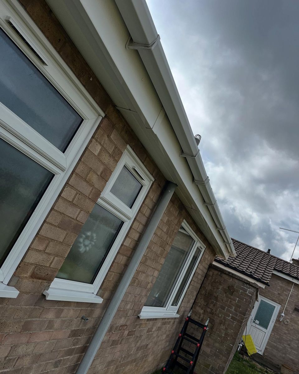The same bungalow gutters and fascias after cleaning, bright white again